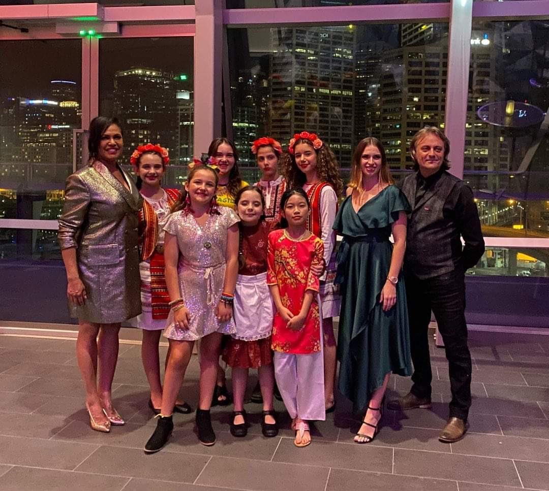 RodinaSydney's tweet photo. Our beautiful and very talented students Sylvia Chervenkova, Tea Karamanlieva and Emma Hogard, performing with Australia’s most popular artist Christine Anu at the 2021 Premier’s Harmony Dinner #premierharmonydinner2021 #multiculturalnsw #phd2021 https://t.co/uhNc06Ko3l