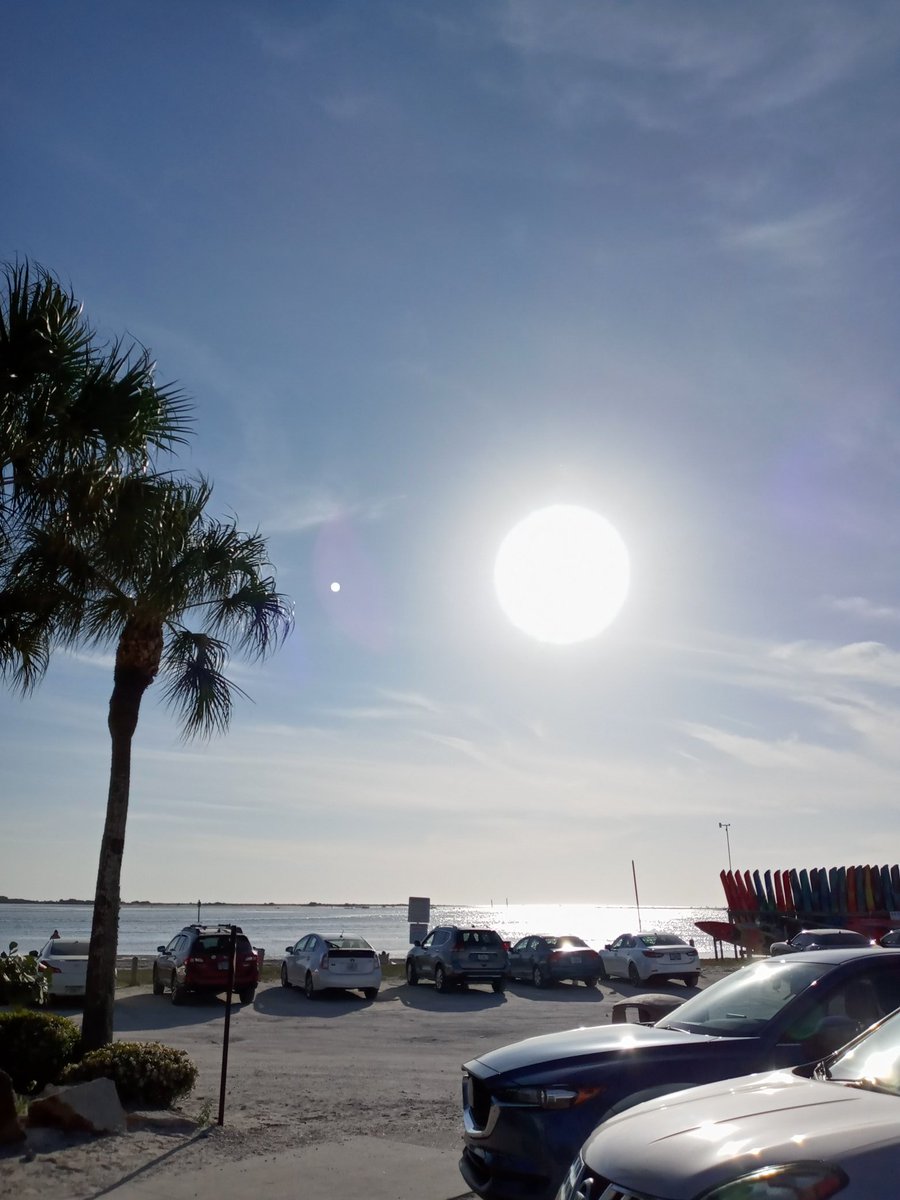 Elizabetmauthor's tweet photo. So...is this sun not monstrous? I held my camera up away from me to take this shot. But is that not the moon to the left of the sun? https://t.co/MwuGp5bo6l