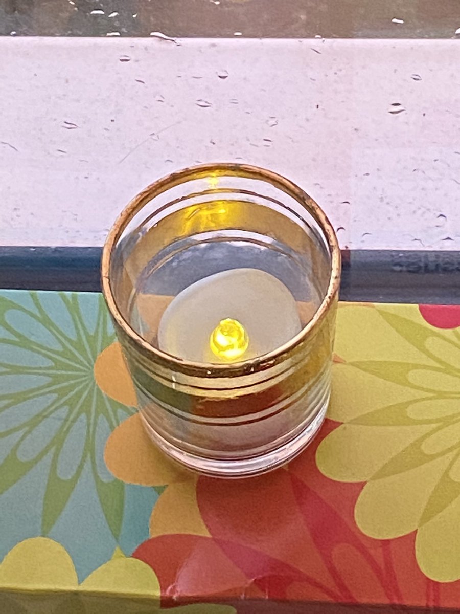 WhitstableCat's tweet image. Squally clouds to the west. Pink skies ahead. A candle lit in memory of #SarahEverard who will never have the opportunity to see either again. All she did is walk #ReclaimTheStreets