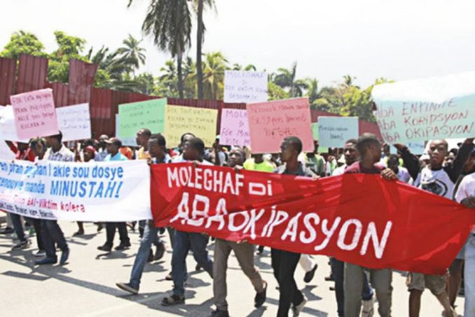 It was decided that the UN would occupy Haiti on a peacekeeping mission. This occupation was marred by the deaths and r #pe of thousands of Haitian people. Aristides political party, Fanmi Lavalas would be barred from participating in the 2006 elections.