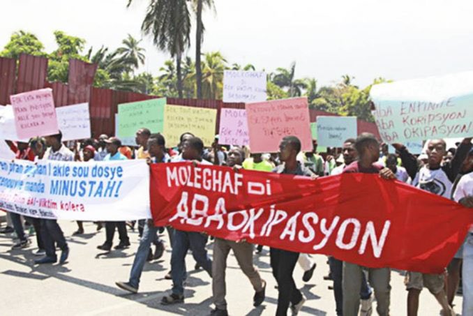 It was decided that the UN would occupy Haiti on a peacekeeping mission. This occupation was marred by the deaths and r#pe of thousands of Haitian people. Aristides political party, Fanmi Lavalas would be barred from participating in the 2006 elections.