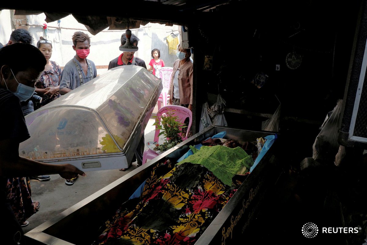 People carry coffin of Kyi Kyi 53, who was shot and killed at her home during the security force crack down on anti-coup protesters in Mandalay, Myanmar March 14, 2021. REUTERS #WhatsHappeningInMyanmar