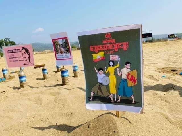 IrrawaddyNews's tweet photo. Protest in jade hub

A protester-free, anti-regime protest was held in Tamakhan village in #Hpakant, #Myanmar’s jade-mining hub, in Kachin State, on Sunday morning. Placards demanded the release of detained leaders and for UN protection. 
(Photo: Kachinwaves) https://t.co/s5xujQ31A5