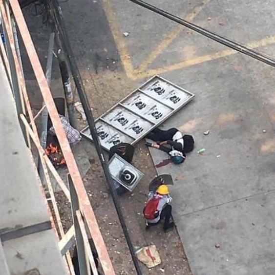 BunnyPhyoe's tweet photo. One civilian got headshot in Tarmwe,Yangon. Terrorists would shoot and arrest civilians who tried to come and help move the injured boy. Now they dragged him into their station. 
#WhatsHappeningInMyanmar
#Mar14Coup
@UN_HRC @IntlCrimCourt @CIJ_ICJ @KenRoth @TostevinM @RapporteurUn https://t.co/pbW957bUKK