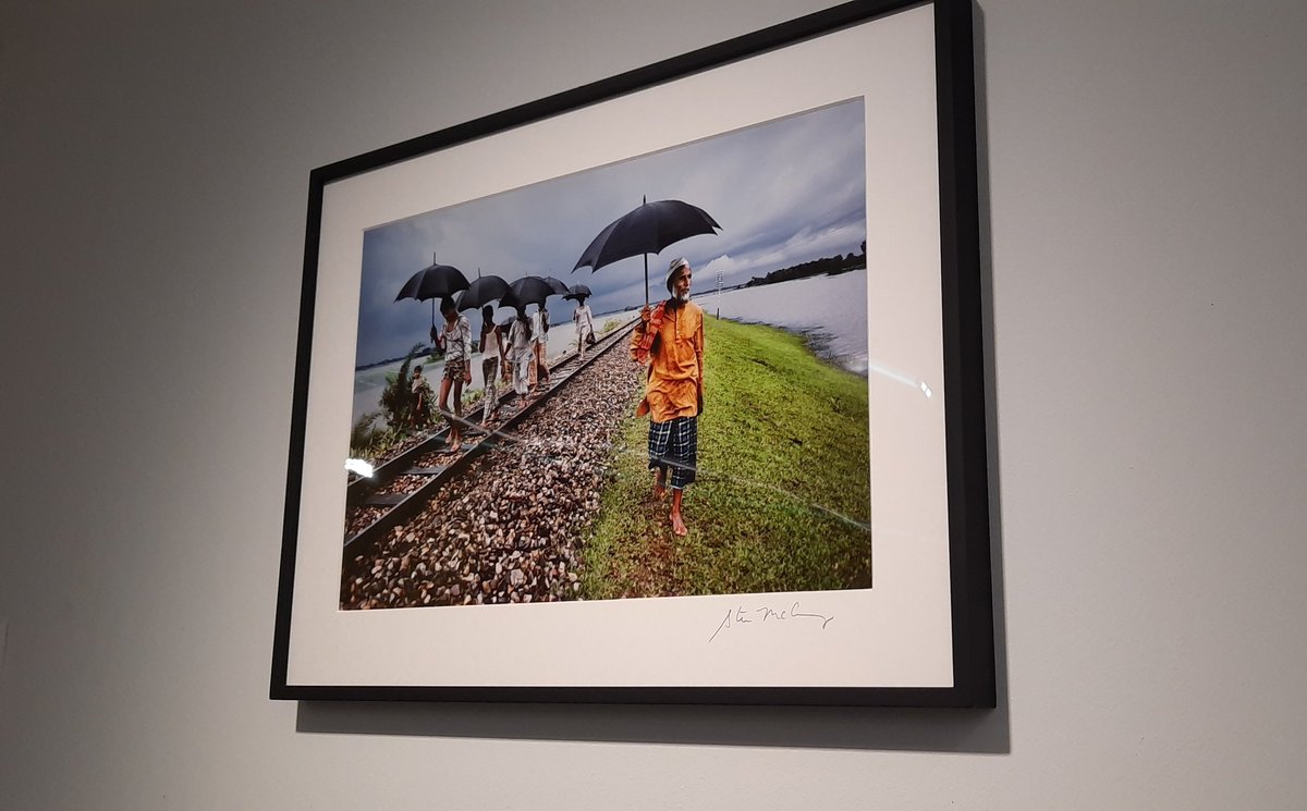 Poverty porn? The frame of this picture alone probably costs more than it would cost to buy everyone in the photo a pair of shoes.

(Seen today in a Swiss gallery)