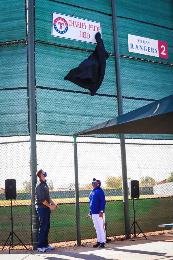 RangerBlake's tweet photo. General Manager Chris Young and coach Tony Beasley unveil the sign on Charley Pride Field on Sunday morning in Surprise. https://t.co/OSpzkdIx79