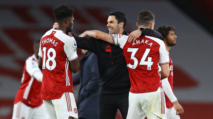 Mikel Arteta celebrates with Thomas Partey and Granit Xhaka at full-time