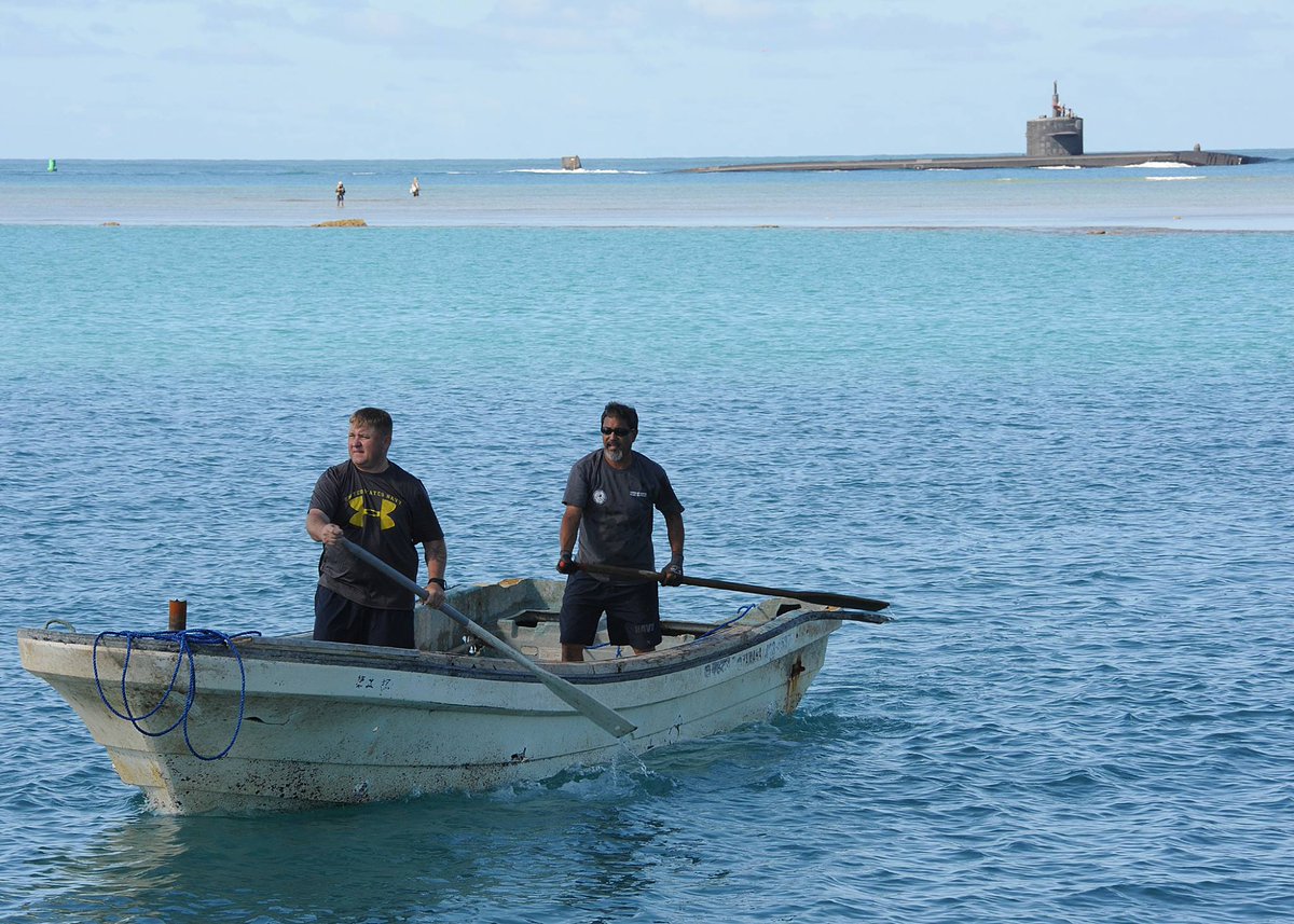 JointBasePHH's tweet photo. #SubSunday | CWO3 Timothy Greene, #PortOps, &amp; Paul Sensano, #DLNR, paddle a skiff that grounded on a reef near JBPHH, possible marine debris from the March 11, 2021 tsunami that devastated many coastal areas in northeastern Honshu, Japan.

📷 MC1 Nardel Gervacio https://t.co/9wC30l7Rvn