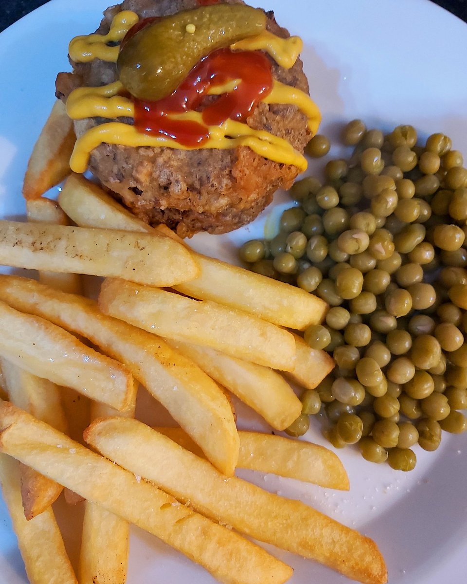 Double battered burgers with cheese, low fat @McCainUKIE chips with marrowfat peas, topped with mustard, ketchup and gherkin #tasty #tastyfoods