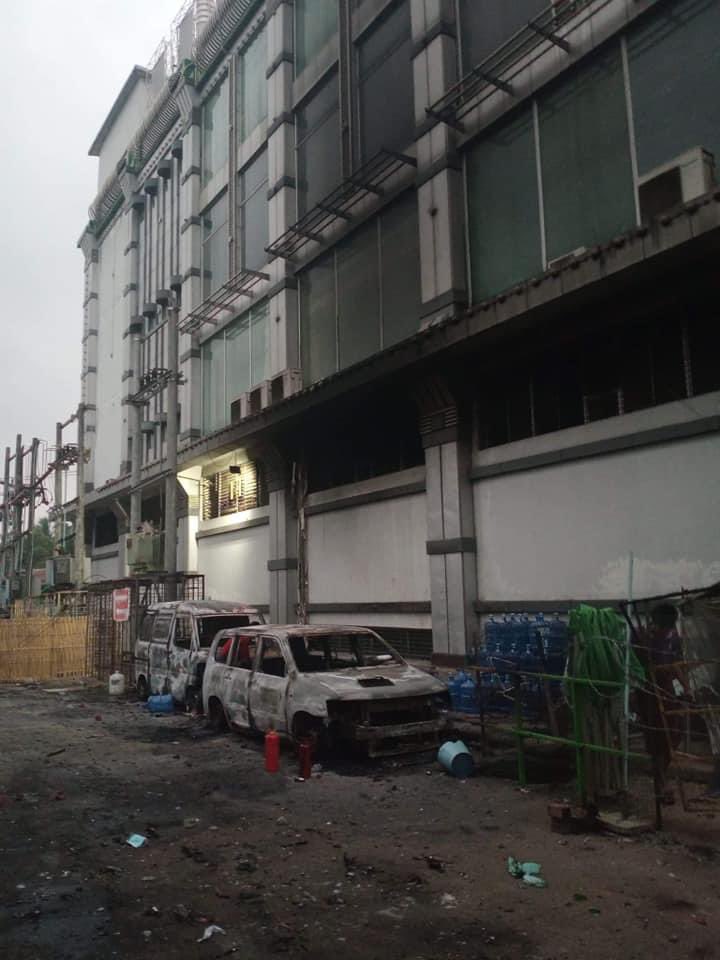 maytoekhine's tweet photo. Two burnt cars were spotted this morning in front of AKK shopping mall in #Thingangyun. Terrorists burning civilians properties. These are the scenes we’d see in movies but this is reality happening right now in #Myanmar. #WhatsHappeningInMyanmar #Mar15Coup https://t.co/ohNCSI2XgR