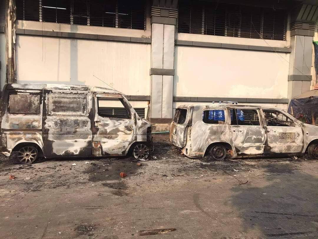 ChitThae97's tweet photo. Two burnt cars were spotted this morning in front of AKK shopping mall in Thingangyun. Terrorists burning civilian's properties. These are the scenes we’d see in movies but this is a reality happening right now in Myanmar. #WhatsHappeningInMyanmar #Mar15Coup https://t.co/JbPnKeSOJd