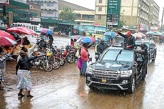 Tbt Campaign Photo Of Uhuru Under Heavy Rains With Low Fuel Prices Background Resurfaces