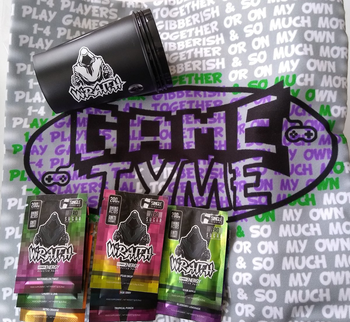 GamesWithTea's tweet photo. Last week I won @GameTymeOFF giveaway and got @DrinkWraith small shaker bundle with 8 flavours and Game Tyme official cushion cover and cushion insert! The quality of the cushion is amazing! (You all know my thoughts on Wraith ... They are the best) Thanks for the awesome items! https://t.co/UZyJt0Kno9