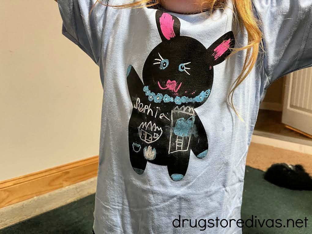 A girl wearing a Chalk of the Town Bunny Rabbit Chalkboard T-Shirt Kit.