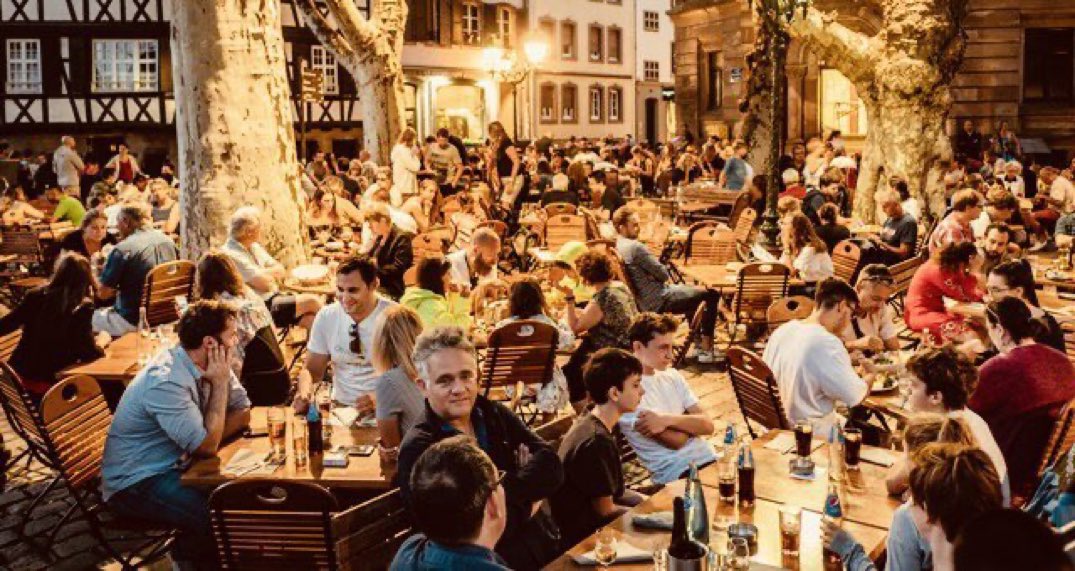 JamesMelville's tweet image. A vintage photo of people socially gathering back in 2019.