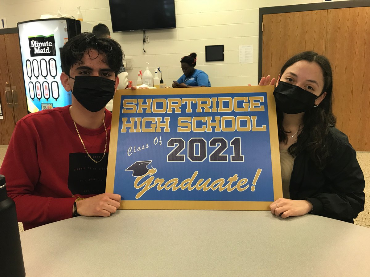 Shortridge's tweet image. Mr Pactor and Mr Thomas and Joel, Helen, Michael, and Alexis are ready to hand out these #graduation yard signs! #FinishStrong