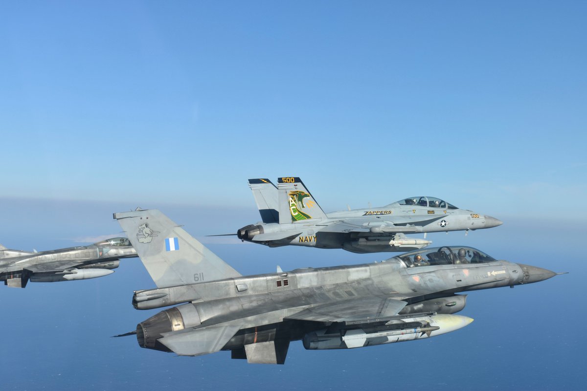 Aircraft from the Hellenic Air Force, front, and CVW3 from USS Dwight D Eisenhower over the Mediterranean Sea, March 12, 2021.  (U.S. Navy photo by Lt. j.g. Kelsey Lynch)