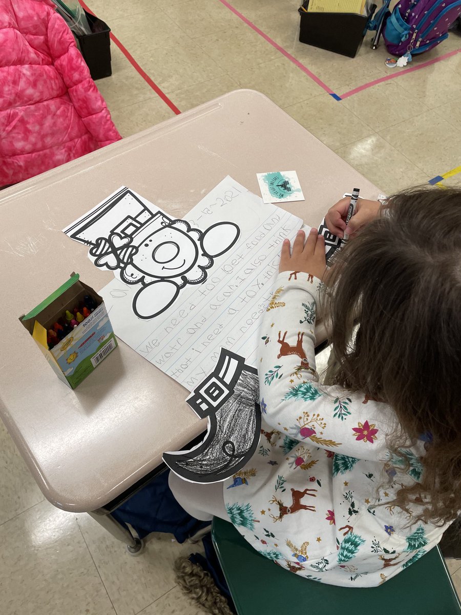 First graders working hard today; reading words with the oo spelling and working on opinion writing.