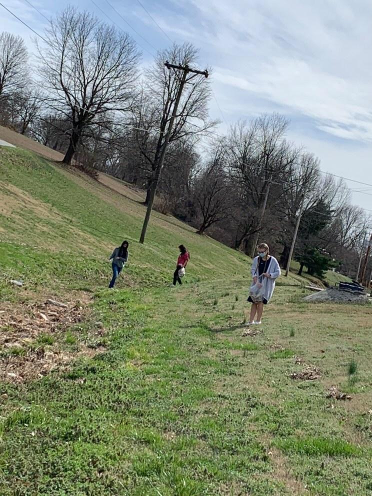 Some of our awesome members picking up trash around Neosho High School!
