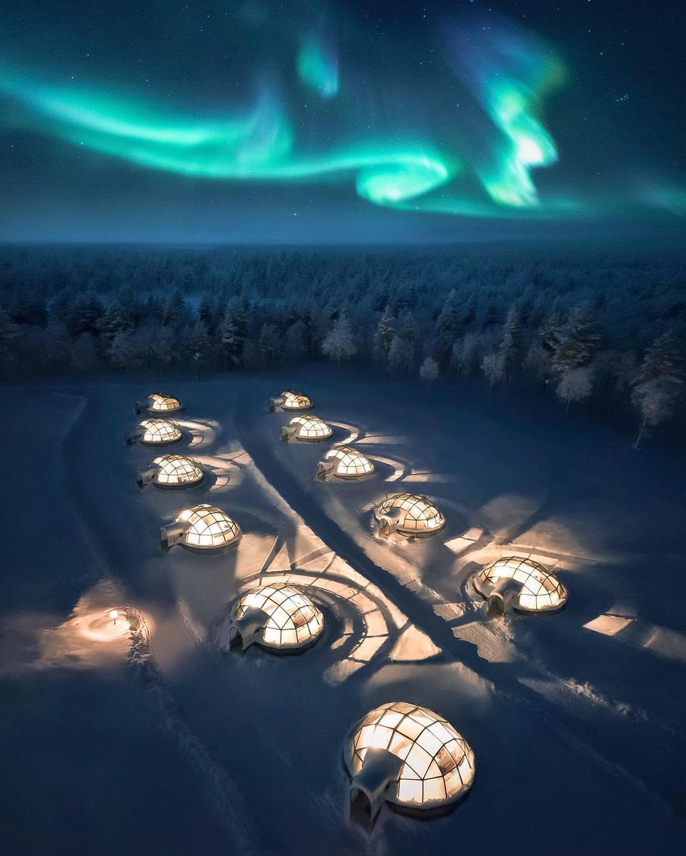 earth's tweet image. Watching Finland's northern lights in glass igloos ❄️