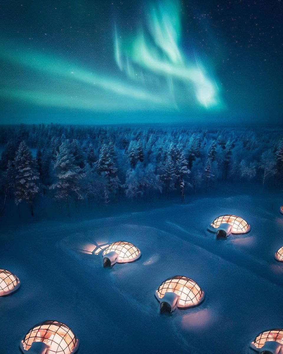 earth's tweet image. Watching Finland's northern lights in glass igloos ❄️