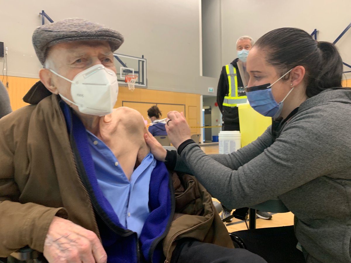 richardzussman's tweet photo. This is 96 year old Paul Rinfret. 

Administering his COVID-19 shot is his grandaughter Marianne Rinfret. She came back early from mat leave to help administer vaccines. 

This is what light at the end of the tunnel looks like. 

(Thanks to Marc Rinfret for sharing)
#bcpoli https://t.co/TPWeDkwnOt