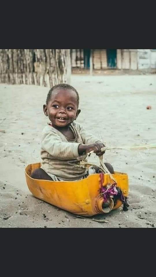 Look how happy this little boy is with his basic "toy" to play with.
Makes you think, doesn't it?