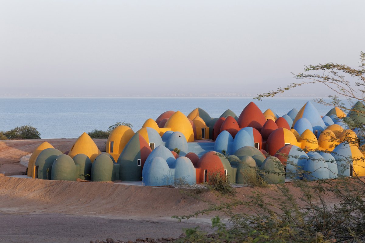 "The colours surrounding us in Hormuz gave us the courage to be bold like the island."

Iranian practice #ZAVArchitects drew on the colourful landscape of the island for this holiday community that is housed in around 200 brightly coloured domes overlooking the Persian Gulf.