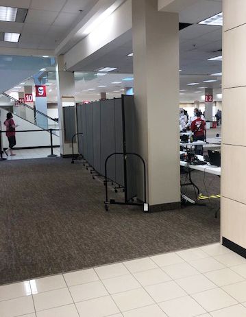 Screenflex's tweet photo. Spotted at a vaccination clinic in Texas, Screenflex Portable Dividers in between socially distanced patients. #CovidVaccine https://t.co/IlIiK3L7hk