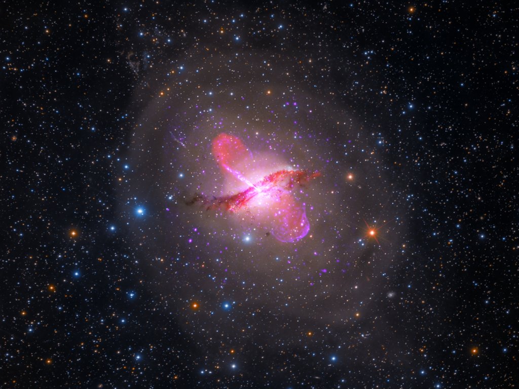 Centaurus A sports a warped central disk of gas and dust, which is evidence of a past collision and merger with another galaxy. It also has an active galactic nucleus that periodically emits jets. It is the fifth brightest galaxy in the sky and only about 13 million light-years away from Earth, making it an ideal target to study an active galactic nucleus – a supermassive black hole emitting jets and winds – with NASA's upcoming James Webb Space Telescope.
Credits: X-ray: NASA/CXC/SAO; optical: Rolf Olsen; infrared: NASA/JPL-Caltech; radio: NRAO/AUI/NSF/Univ.Hertfordshire/M.Hardcastle
