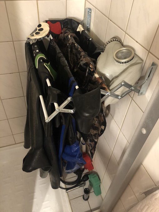 Oof why is it always that hard to wash fetish stuff ??? #rubber #latex #dog #petplay #gasmask #mask #bath