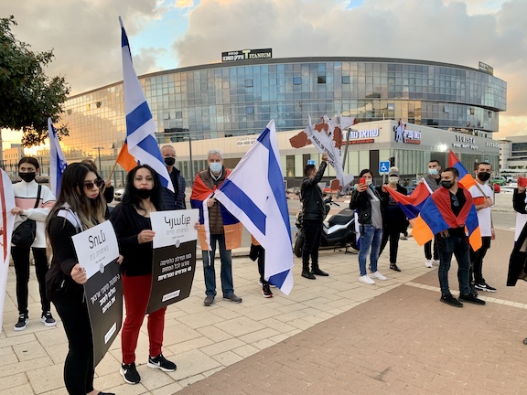Asbarez's tweet photo. The Union of the Armenian Communities in Israel organized a demonstration on Tuesday to protest @ElbitSystemsLtd, an international defense electronics company that manufactures weapons supplied to Azerbaijan. https://t.co/jEjFSBOAJb https://t.co/DRak54pfo0