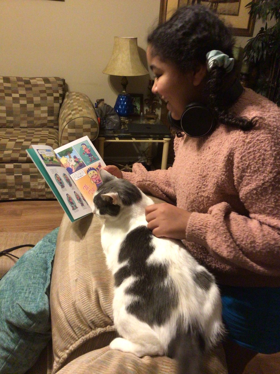 GevaLibrary's tweet image. GeVA 5th grader Adryana Taylor reads to her cat. #GeVAReads #BetterTogetherGCS #GCSLibraryMedia