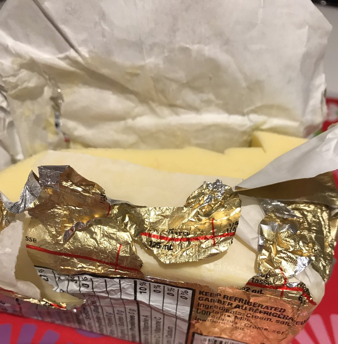 TopTweeterGirl's tweet photo. I’ve been eating #Lactantia butter for over 25 years but your new wrappers are flimsy and useless. I will now have to find a new brand with a wrapper that doesn’t tear the minute you open it. Not a great executive move replacing it. #butter #cheapingout #food #cooking #groceries https://t.co/gTH8TcOW2y