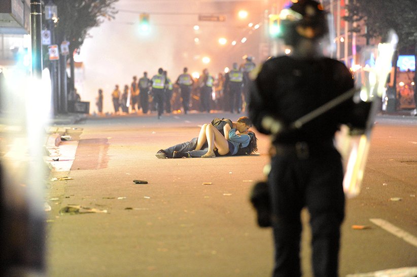 The Art of Album Covers .Richard Lam’s picture of the “kissing couple” was taken as he covered the riots that followed the Vancouver Canucks' 4-0 loss to the Boston Bruins in the Stanley Cup..Used by Placebo on A Place for Us to Dream, released Oct 2016HT  @MarkHawkns