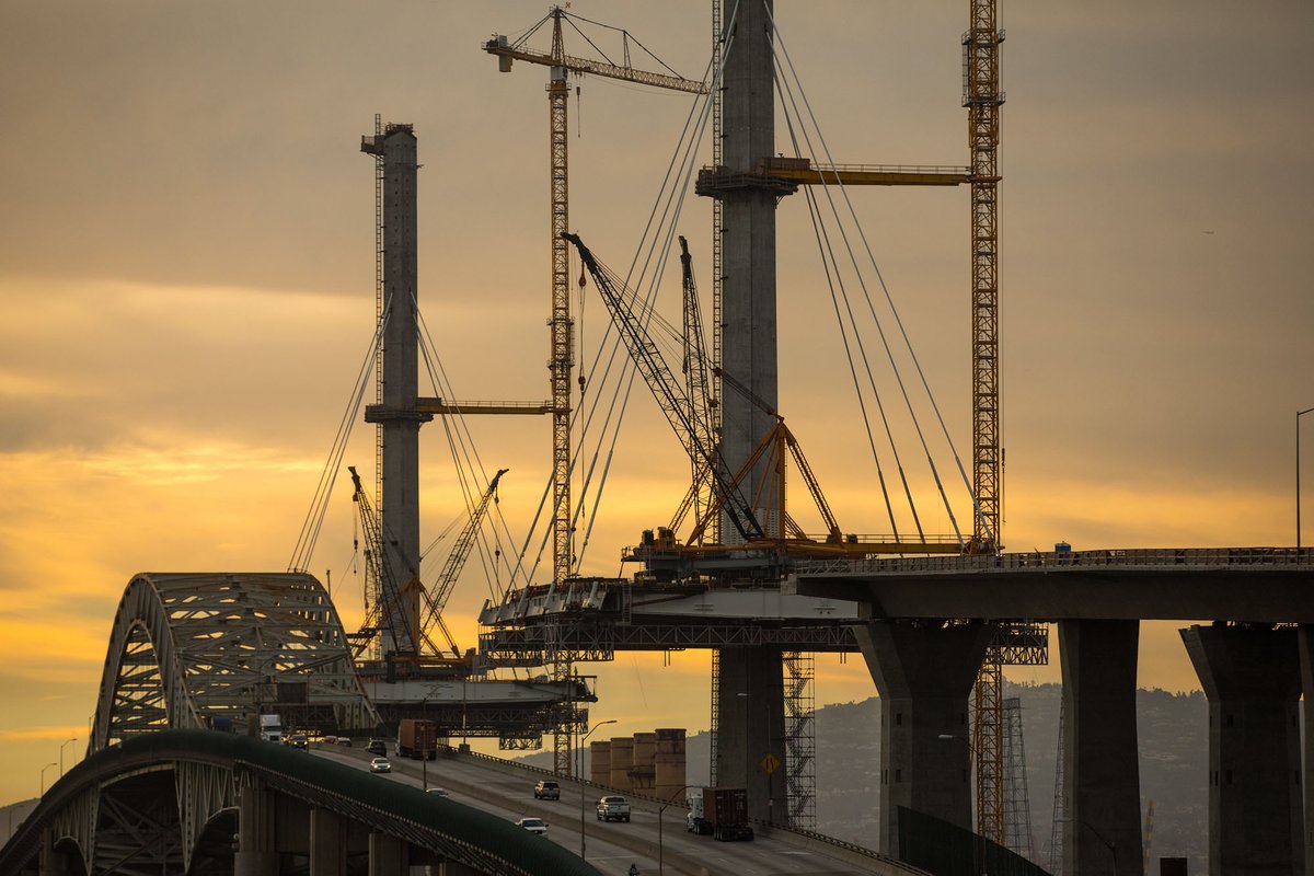 The over-water portion of the bridge was built symmetrically in a technique known as “balanced-cantilever” construction. Segments were added on both sides of a tower at the same time, held aloft by the cables threaded from the top of the tower. #LetsBuildABridge