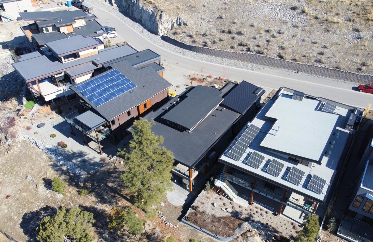 SkyFireEnergy's tweet photo. We recently installed a 10.4 kW system on the middle home for a retired couple who wanted to reduce their monthly expenses on their newly built home. Contact us at 1-877-593-4731 or welcome@skyfireenergy.com for a quote. #bchomebuilders #customhomes #lakecountry #bcsolar #gosolar https://t.co/7L5smyY5Nr