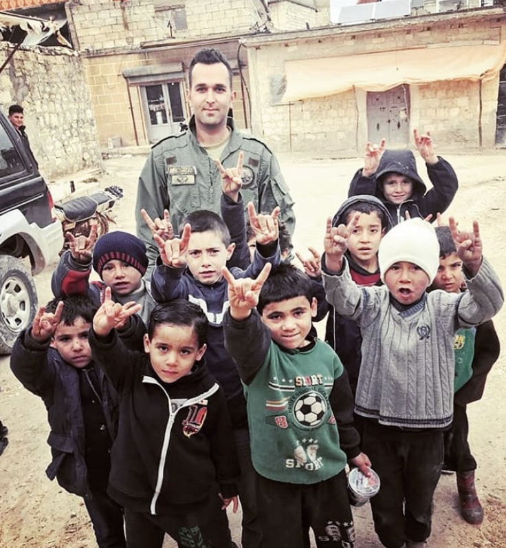 LindseySnell's tweet photo. Afrin. "Make a racist, nationalist hand gesture for a picture with the Turkish soldier, [Syrian] kids!" https://t.co/SrlTcJTnRK