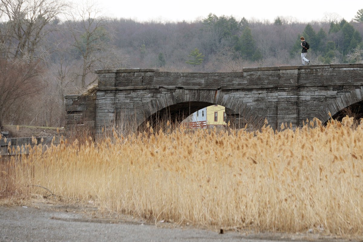 EricaPhotog's tweet photo. Chris Giglio, 16 of Fort Hunter, enjoys the warmer temperatures while drawing outside on the #SchoharieCrossing Aqueduct over Schoharie Creek #FortHunter #518wx https://t.co/NmGziEVBzI