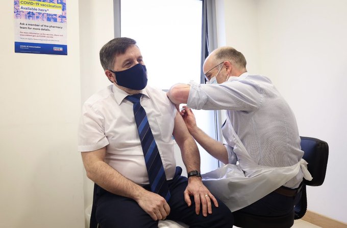 Minister Swann receiving vaccine
