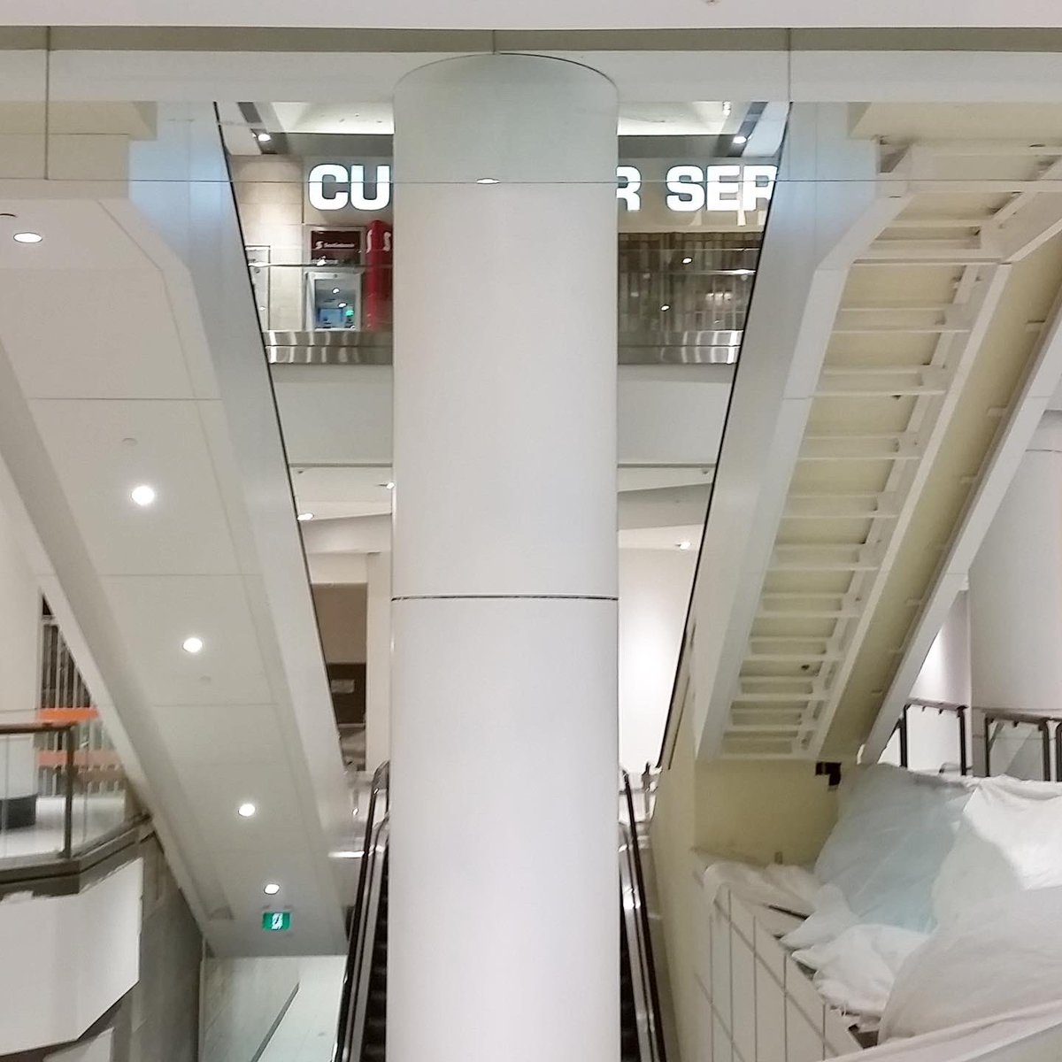 laborincca's tweet photo. Prior to the expansion of The Rideau Centre, the mall went through a renovation. From custom "Stealth" Ceiling features, 3 story column claddings consisting of aluminum and Corian, to escalator cladding wrapping with a Corian light cove detail built in - we did it all! #Laborinc https://t.co/n4GrI5iNlC