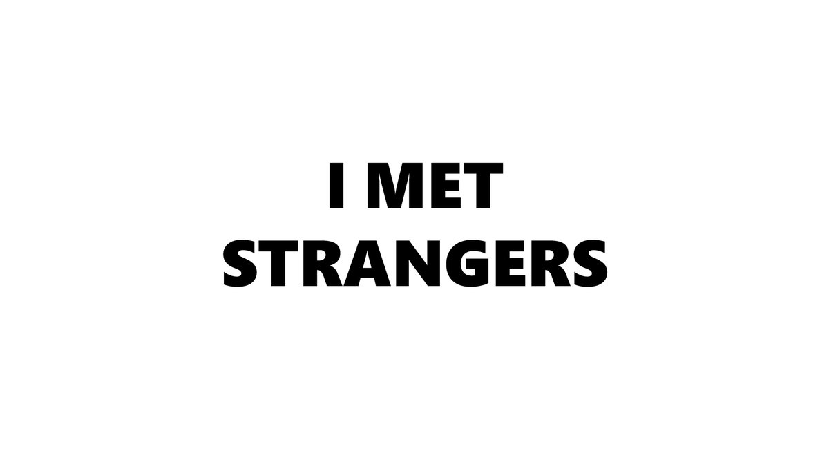 White background with black text that reads "I met strangers" 