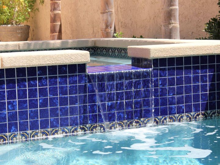 NPT's Akron Field pool tile, shown here in Royal Blue, has a stamped appearance that gives your pool surface dimension. Pair with a decorati...