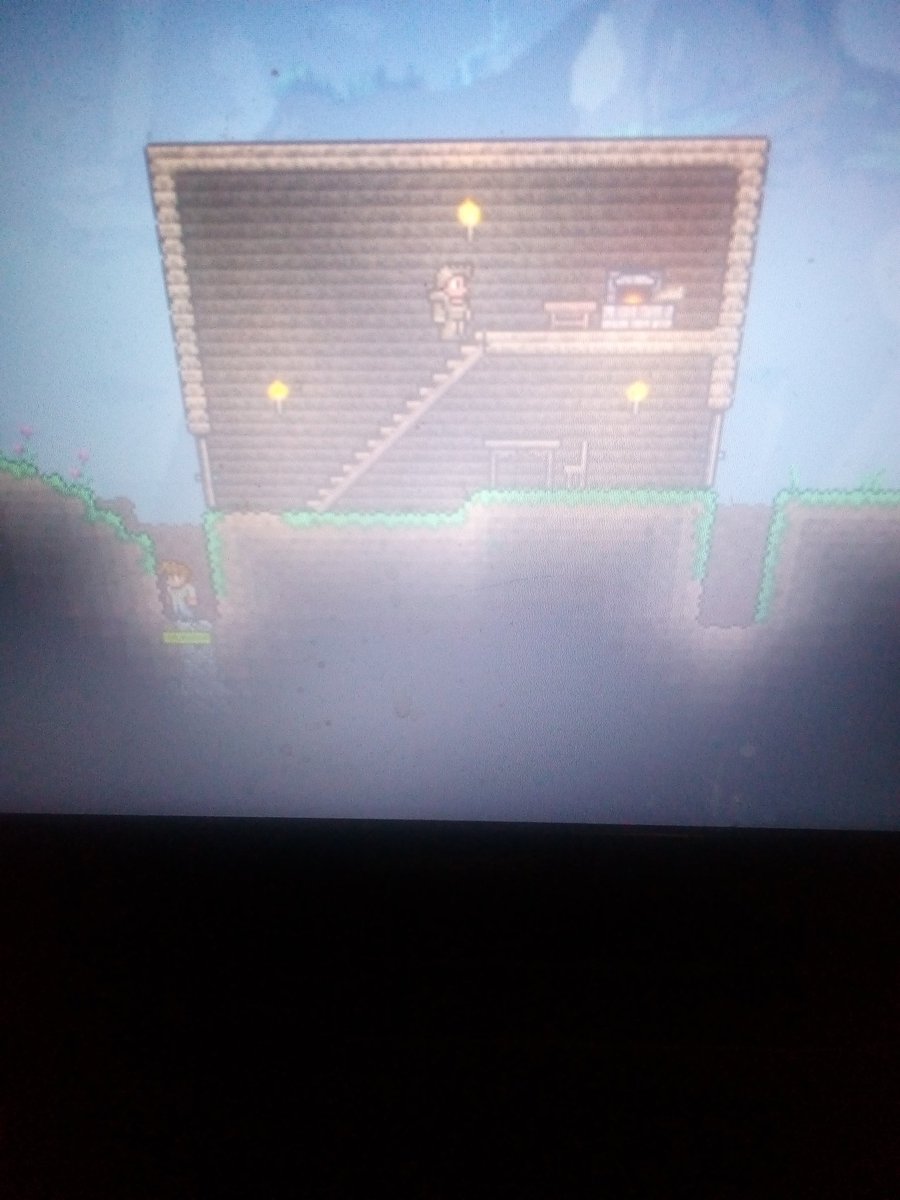 FluffyDragon098's tweet photo. I go sleep see ya tomorrow guys oh and here's my house in Terraria I did the holes cause the zombies can't break doors while jumping and the guy in the hole is a friendly NPC https://t.co/zWQUgLcmgH