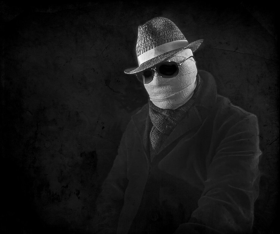 Claude Rains as the Invisible Man, sunglasses and overcoat, hat and bandages