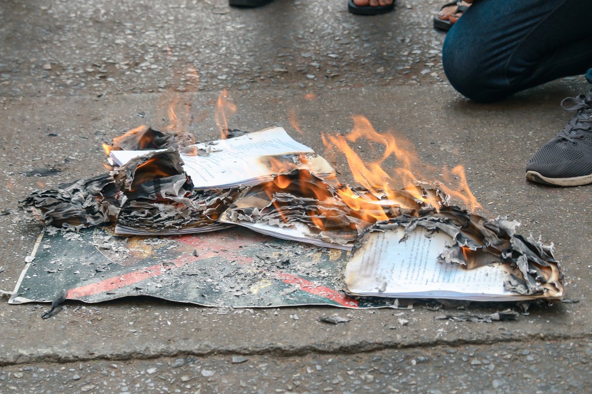 Anti-coup protesters burn a paper copy of the 2008 Constitution in Yangon's Hlaing township today, following an announcement by the CRPH-- a body representing some of Myanmar's elected lawmakers-- that the Constitution has been abolished. #WhatsHappeningInMyanmar