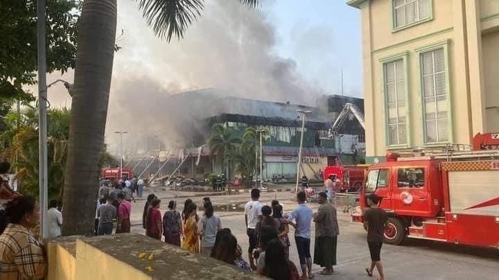 IrrawaddyNews's tweet photo. The military regime-owned Ruby Mart in downtown #Yangon and Gandamar Wholesale in the northern part of the city were burned to ashes early on April 1. #WhatsHappeningInMyanmar https://t.co/8zDx8xJgFa