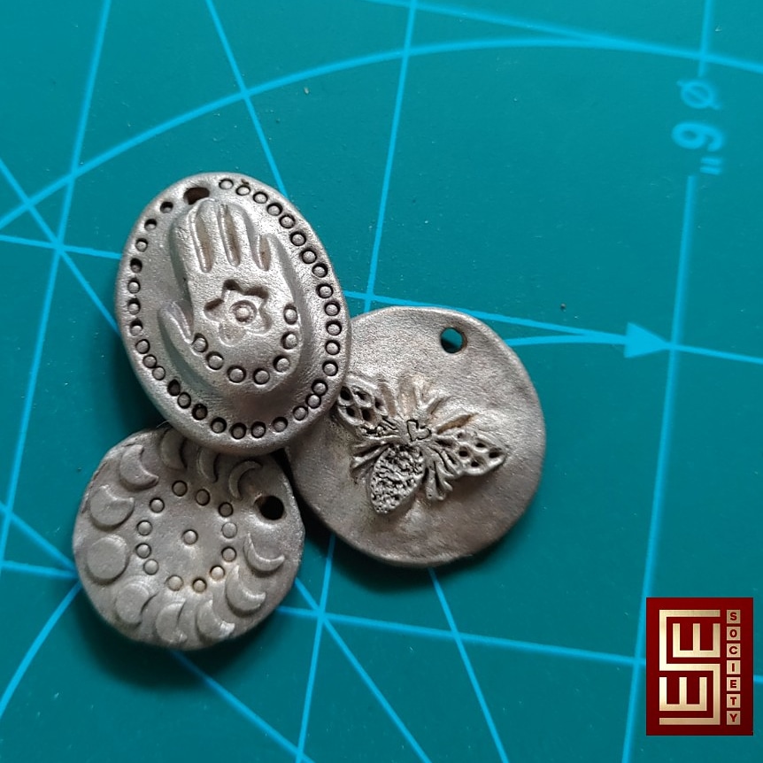 swwsociety's tweet photo. New #handmade #talisman, plus different interpretations on one's you've seen.
These pieces had just come out the #kiln & had #firescale removed.
I will now spend several hours this weekend #polishing them until their beautiful #golden jeweller's #bronze colour shines through. https://t.co/N6WZliG1vp