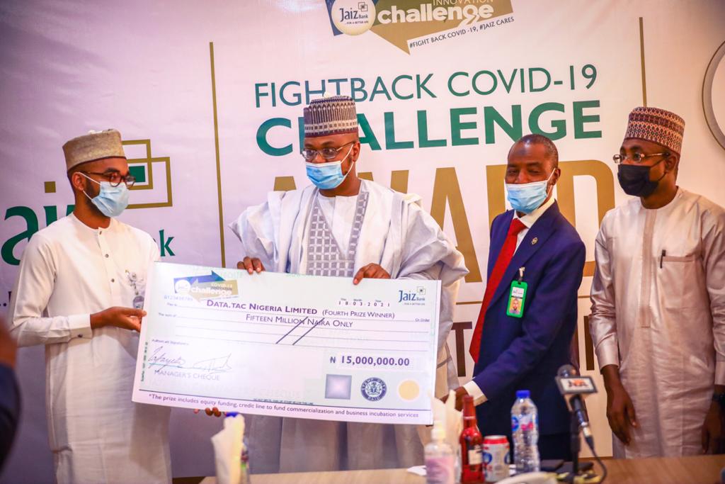 FMCIDENigeria's tweet photo. The Special Guest of Honour,  Honourable Minister of Communications and Digital Economy, @DrIsaPantami presenting the 4th prize winner of the Fight Back #COVID19 Innovation Challenge organized by Jaiz Bank with a cheque of 15M. (Data TAC Nigeria Limited)

#DigitalNigeria https://t.co/B7clVDIZnn