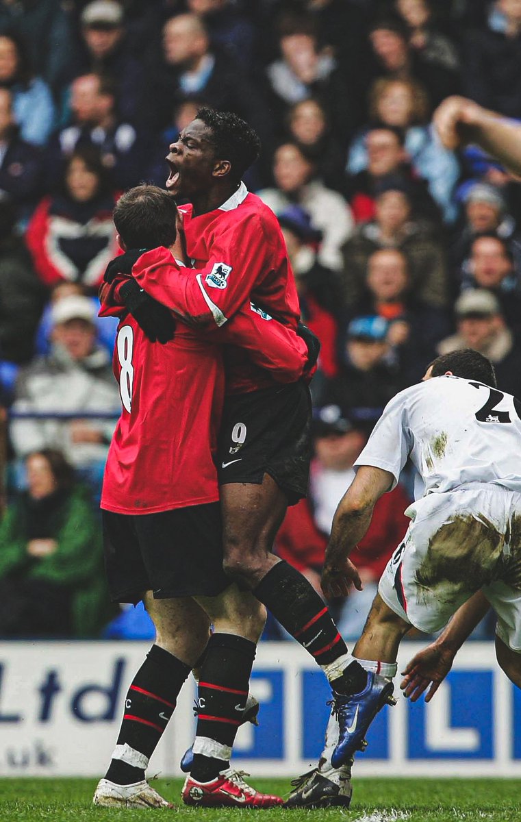 Louis Saha celebrates with Wayne Rooney after scoring the first goal of the game in a Premier League match against Bolton, April 2006.